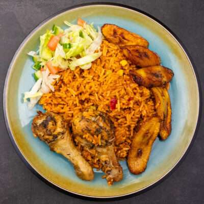 Jollof rice with chicken and plantain served in Nørrebro, Denmark